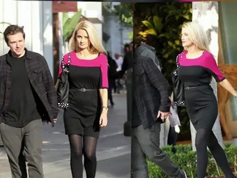 Pregnant Holly Madison Shows Off Her Growing Baby Bump in Belted Dress