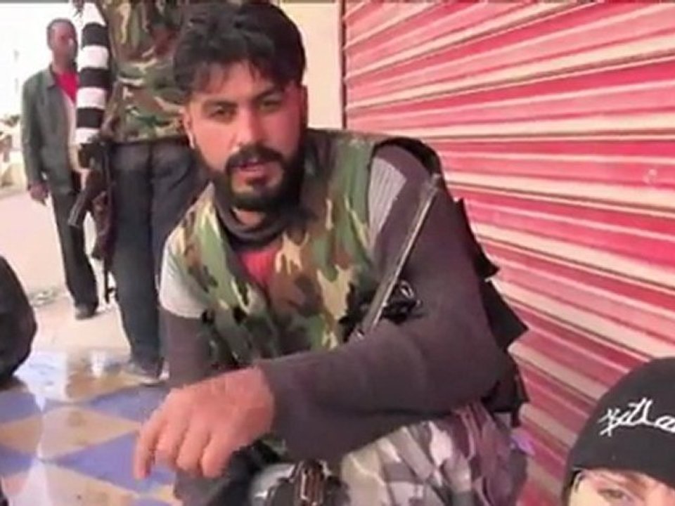 Syrian troops shell Homs, Russia warns of civil war