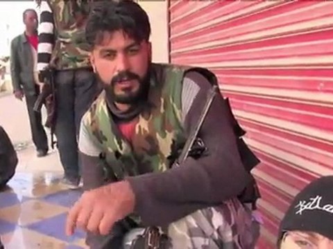 Syrian troops shell Homs, Russia warns of civil war