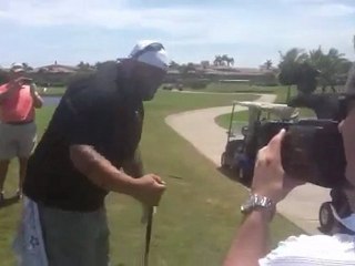 Mike Tyson meets Brodus Clay at the WrestleMania Pro-Am Golf Tournament