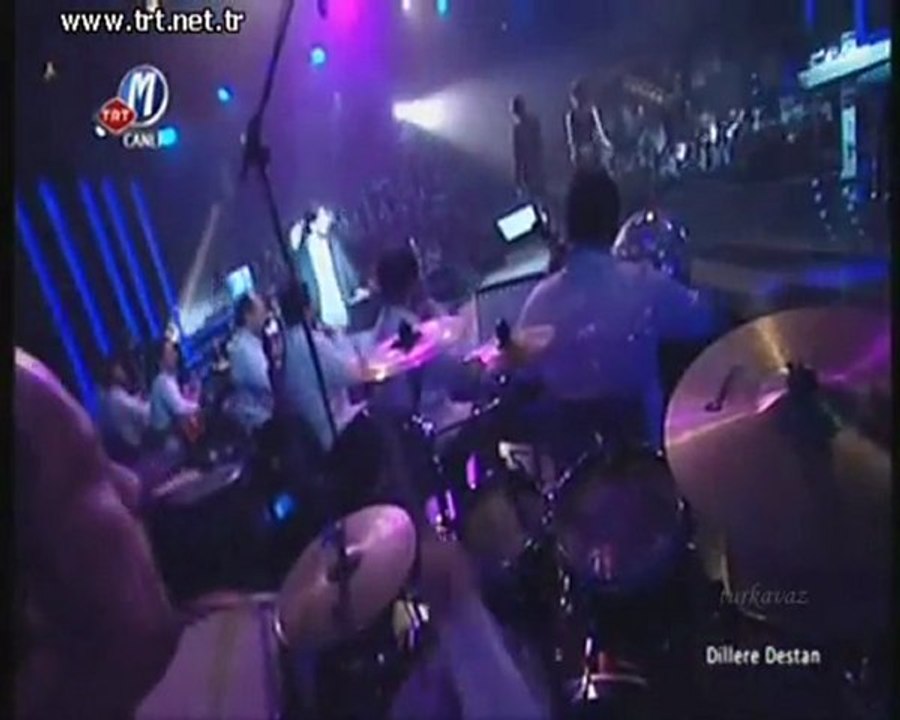 S.Orhan O.Şan Mavi yelek mor düğme TRT