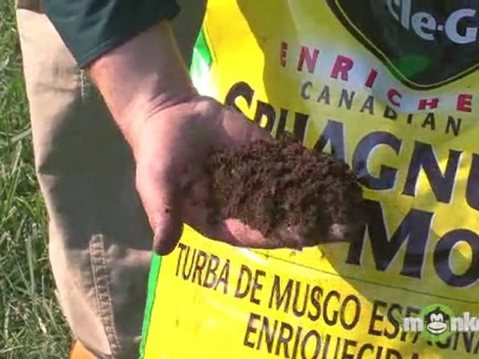 Adding Garden Soil Compost to a Raised Garden Bed