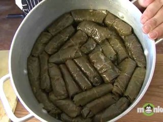 Layering Stuffed Grape Leaves Before Cooking