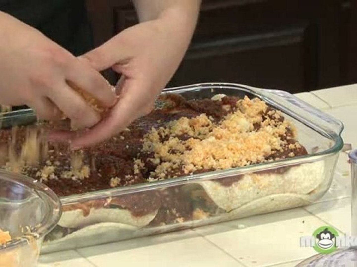 ⁣Topping and Baking Enchiladas