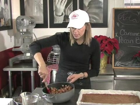 Adding the Caramel Topping to the Pecan Bars
