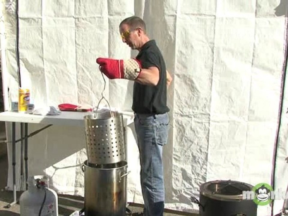 Placing Turkey Into a Deep Fryer