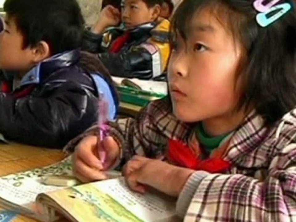 Woman carries disabled granddaughter over mountain to school