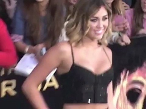 Miley Cyrus Shows Off Her Slim Figure in a Tiny Crop Top