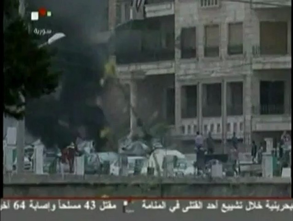 Syrian TV reports armed groups attack state broadcasting building