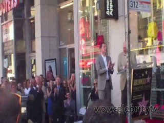 Jon Cryer singing at his star ceremony on hollywood walk of fame