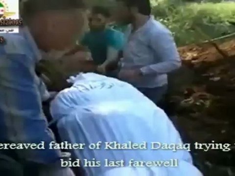 فري برس Syria Homs Bereaved father of Khaled Daqaq at the burial of his son Killed by Assad's 5 5 2012