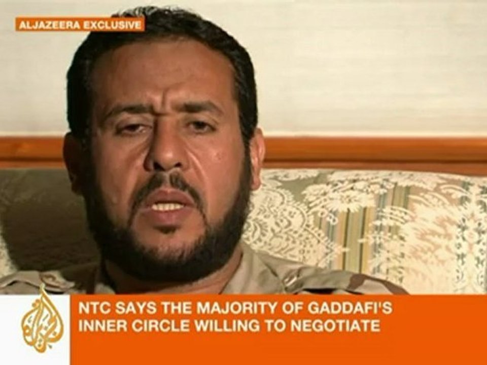 NTC says Gaddafi's son "wants to surrender"