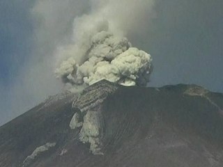 Mexican volcano spews ash and gas