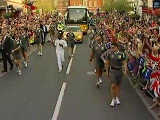 Will.i.am carries the Olympic torch