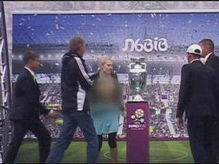 Topless woman tries to steal Euro 2012 cup