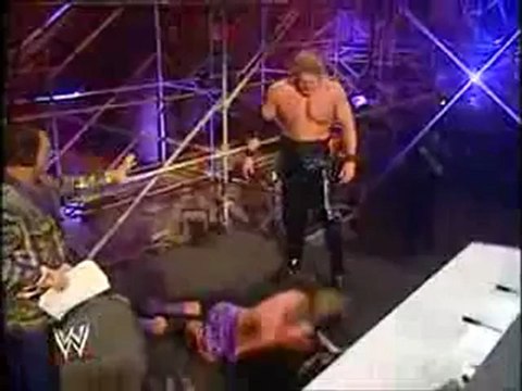 WWE Kevin Nash Jackknife Powerbombs Triple H Through The Announce Table