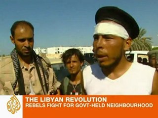 Rebels fight for Gaddafi-held neighbourhood