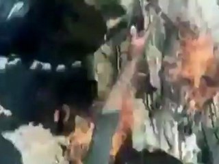 Syrian soldier captured from burning tank