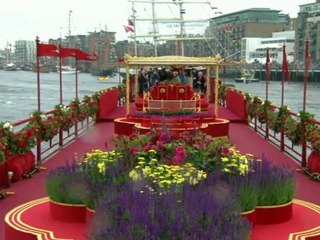 The Royal barge passes under Tower Bridge