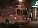 Girl passed out in front of bars Ambulance lights sirens