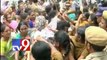 Women protest outside Warangal Excise office against liquor tendors