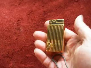 wind up musical cigarette lighter vintage