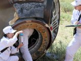Astronautas chineses de volta à Terra