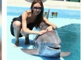 Victoria Beckham Proves She Can Smile as She Cuddles Up to a Dolphin