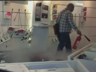 Man destroys inside of mobile phone shop