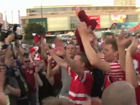 Danish fans go wild in Warsaw fan park at final whistle after beating Holland 1-0