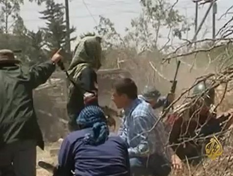 معارك بين الثوار وكتائب القذافي على مشارف طرابلس