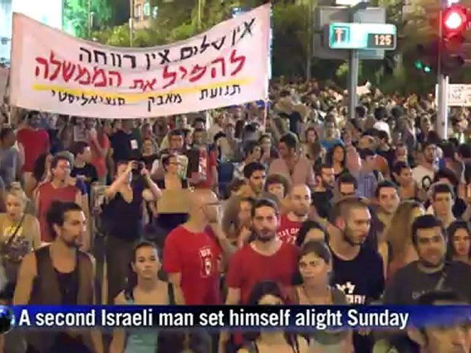 Demonstrators in Israel commemorate dead protester