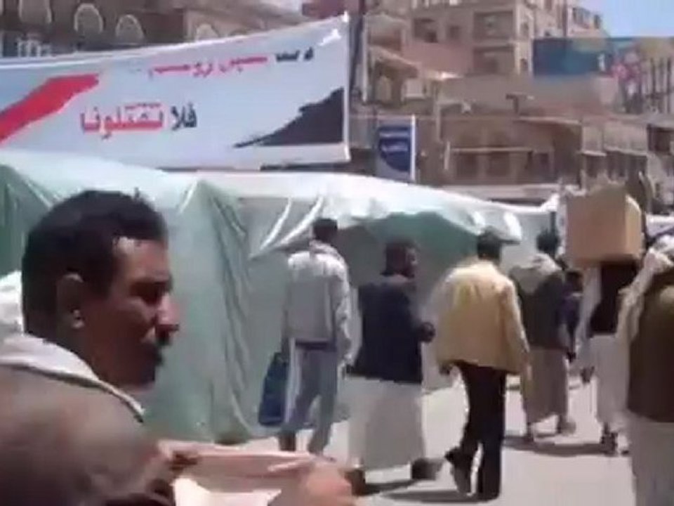 Protesters enter Sanaa's "Change Square" before Friday prayers