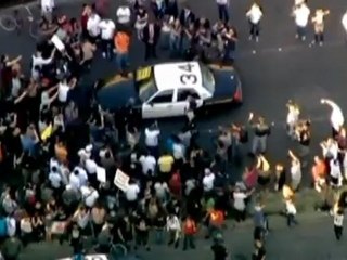 Police and protesters clash after California shooting