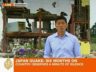 Japan marks six months since disasters