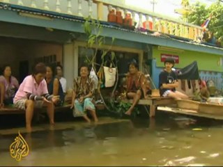 Thais wait for water levels to drop