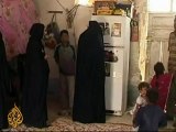 Iraqis make a living among the dead