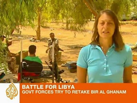 Libyan rebels battle for western town on road to coast