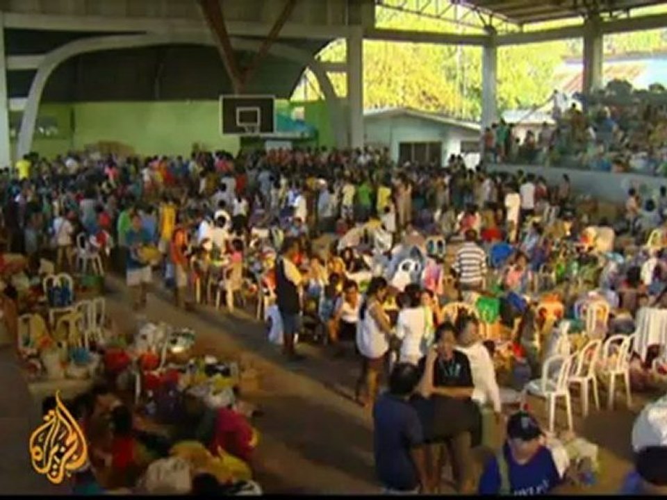 Philippines prepares mass burials for flood victims