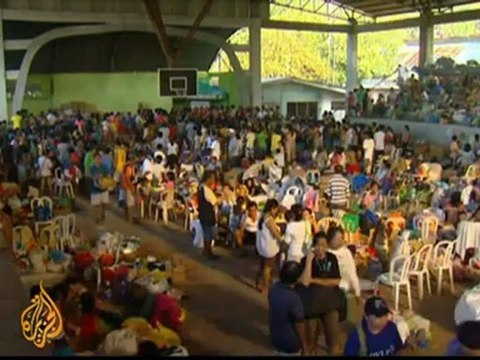 Philippines prepares mass burials for flood victims