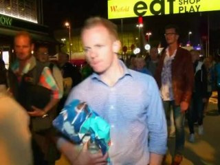 Spectators give their reaction to the Olympic ceremony