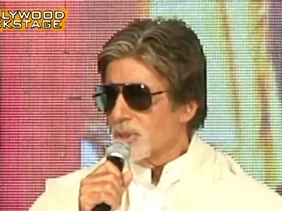 Amitabh Bachchan carries the London Olympic 201...