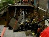 Reporter flees Taiwan road collapse
