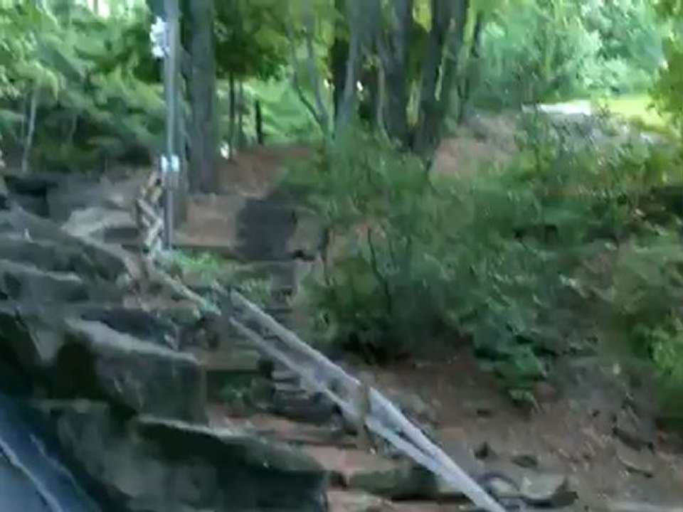 Beautiful Water Slide - This outdoor water slide made of stone leads to a pond. Outdoor fun. Nature. Water slide. Nature park.