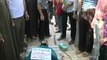Near Aleppo, Syrian rebels bury two fallen comrades