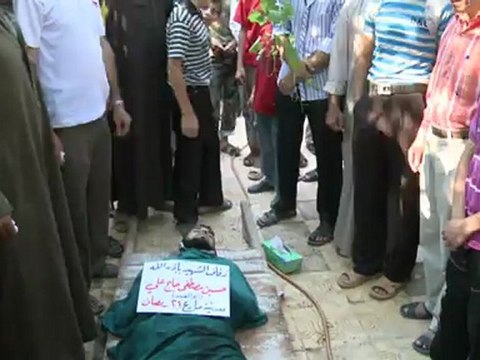 Near Aleppo, Syrian rebels bury two fallen comrades