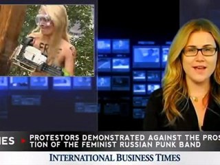 Topless Female Protester Brings Down Orthodox Cross with Chainsaw