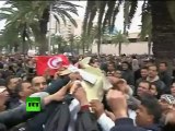 Tunisian protesters smash police cars, tear gas fired