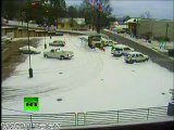 CCTV: Snowplow falls into hole, tips over