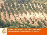 Syrian troops mass on Turkey border